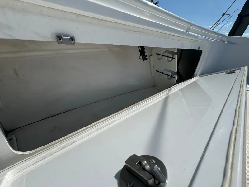 Slide: The Image of Storage compartment of 2011 Everglades 325 Center Console boat, open and empty. - 20