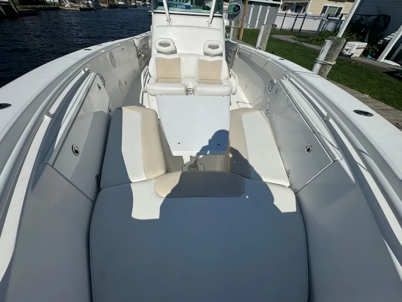 Slide: The Image of 2011 Everglades 325 Center Console boat with spacious seating and sleek design. - 23