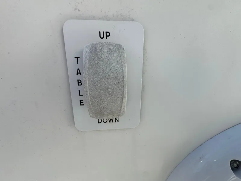 Slide: The Image of Switch for table adjustment on 2011 Everglades 325 Center Console boat. - 24