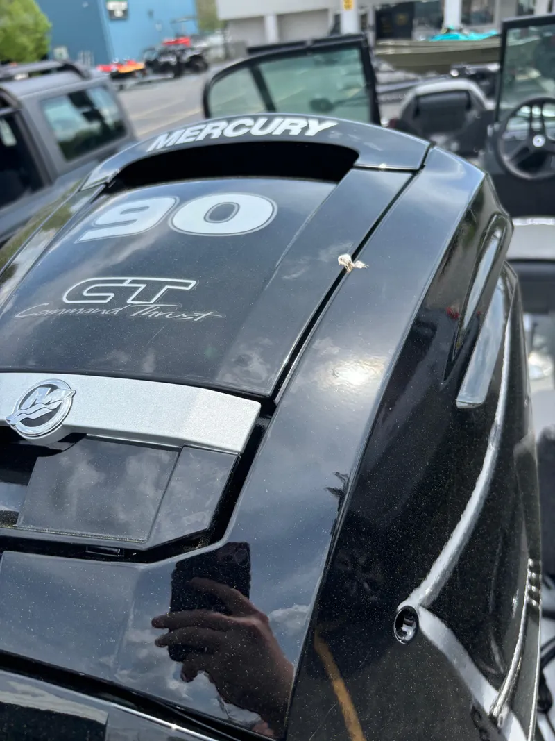 Slide: The Image of 2025 Lund 1650 Rebel XL Sport with Mercury outboard motor, close-up view. - 4