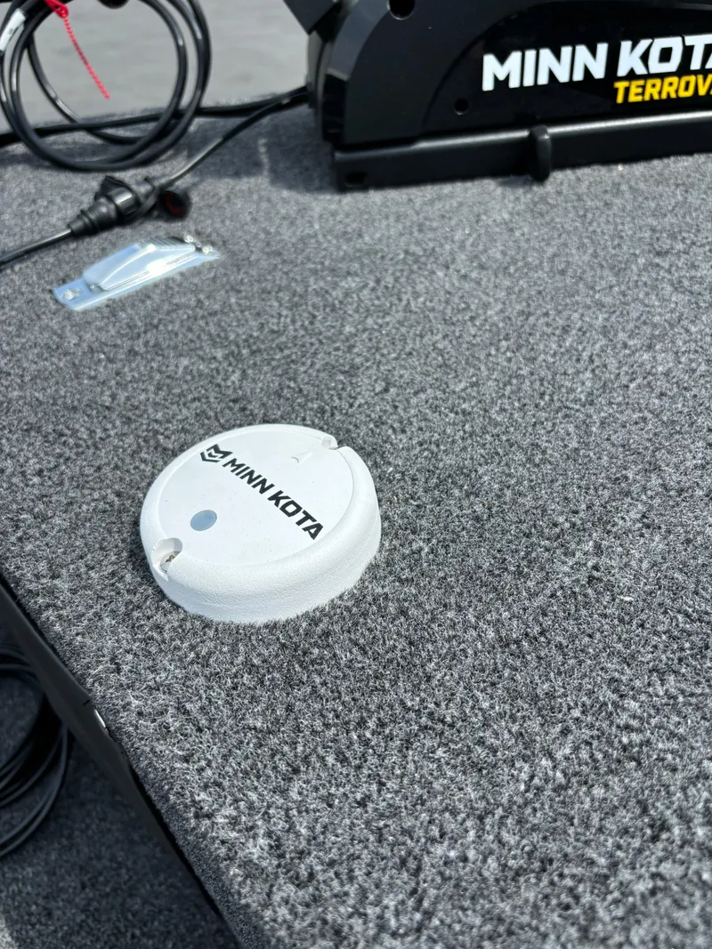 Slide: The Image of Minn Kota accessory on 2025 Lund 1650 Rebel XL Sport boat deck. - 9