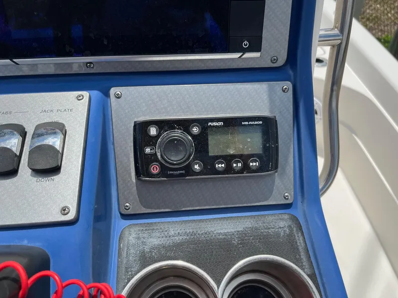 Slide: The Image of Boat dashboard with Fusion stereo system on a 2017 ShearWater 23LTZ. - 5