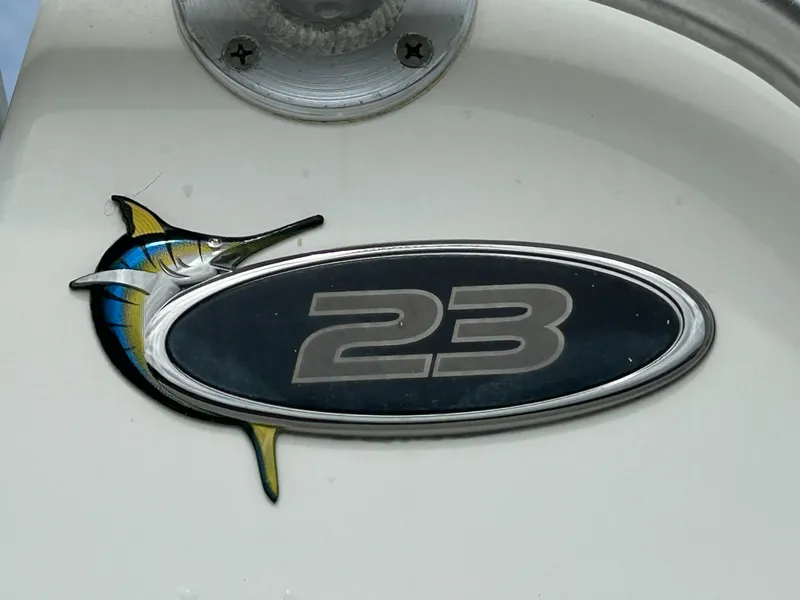 Slide: The Image of Regulator 23' Center Console boat emblem with marlin design, year 2000 model. - 1