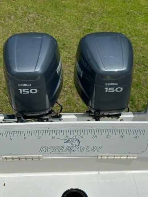 Slide: The Image of 2000 Regulator 23' Center Console with twin Yamaha 150 engines. - 21