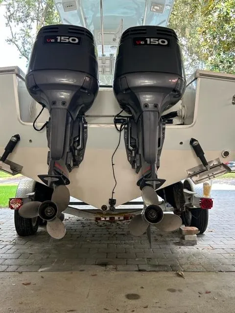 Slide: The Image of 2000 Regulator 23' Center Console with twin V6 150 outboard engines. - 24