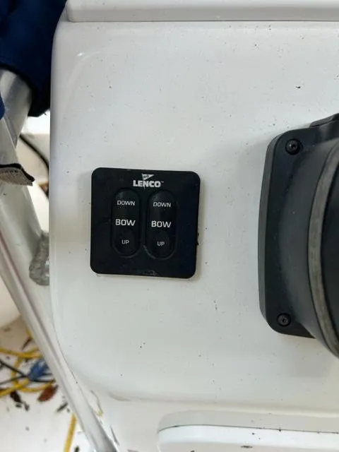 Slide: The Image of Lenco trim tab control on 2000 Regulator 23' Center Console boat dashboard. - 7