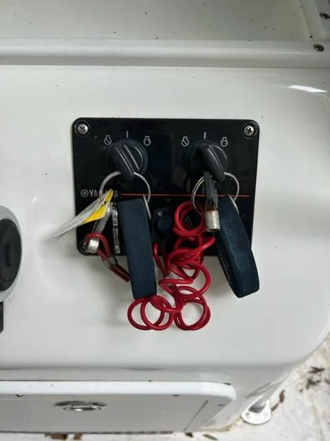 Slide: The Image of Keys and ignition switches on a 2000 Regulator 23' Center Console boat. - 9