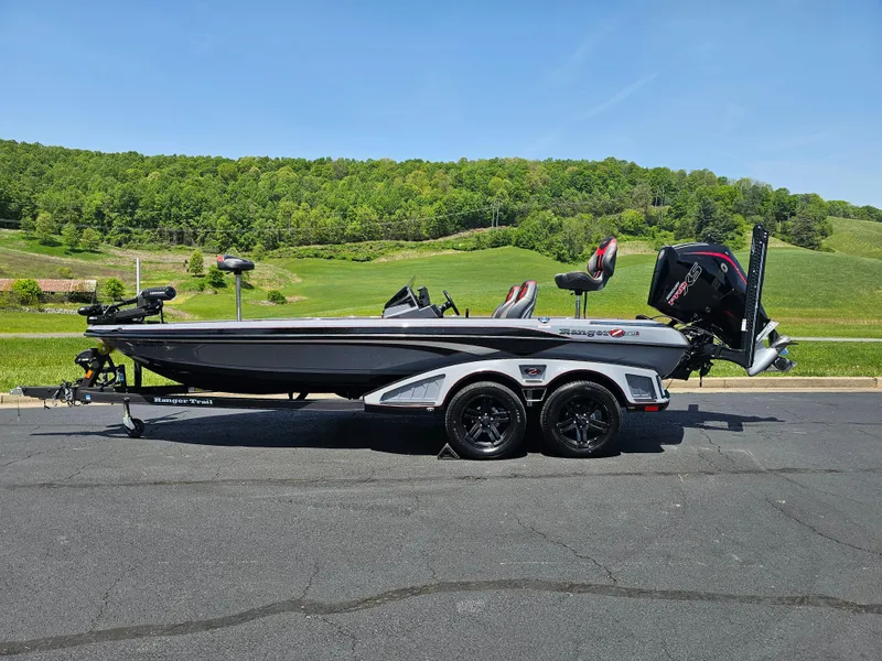 Slide: The Image of 2023 Ranger Z520R 55th Anniversary Limited Edition boat on a trailer, scenic background. - 1