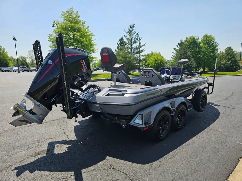 Slide: The Image of 2023 Ranger Z520R 55th Anniversary Limited Edition boat in a parking lot. - 4