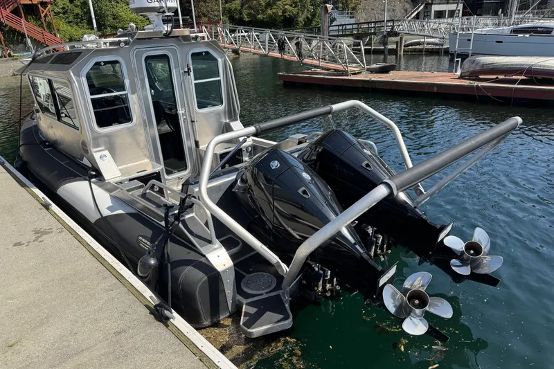 Slide: The Image of 2021 Life Proof 25 Full Cabin boat docked with dual outboard motors. - 10