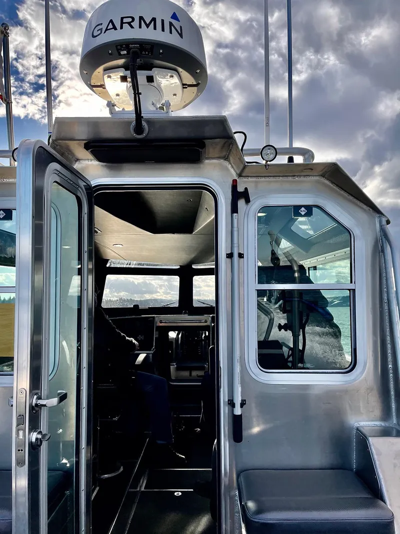 Slide: The Image of 2021 Life Proof 25 Full Cabin boat with Garmin equipment, showcasing sleek design and modern technology. - 12