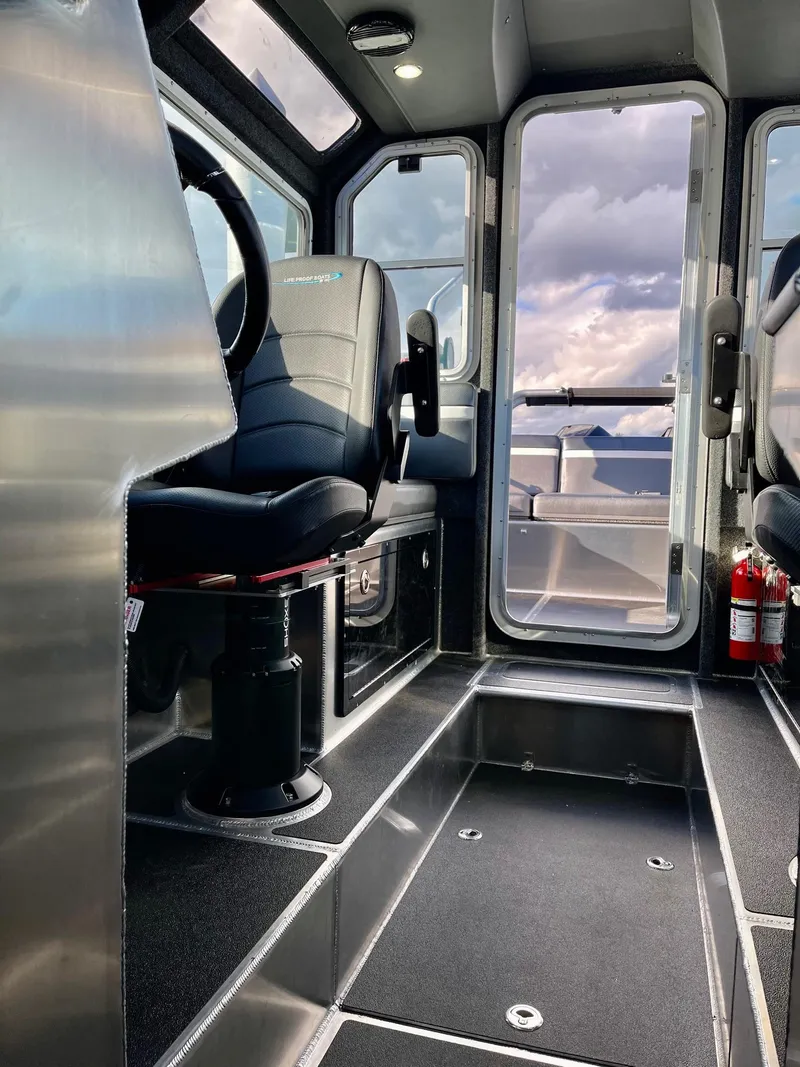 Slide: The Image of 2021 Life Proof 25 Full Cabin interior with modern seating and panoramic windows. - 16