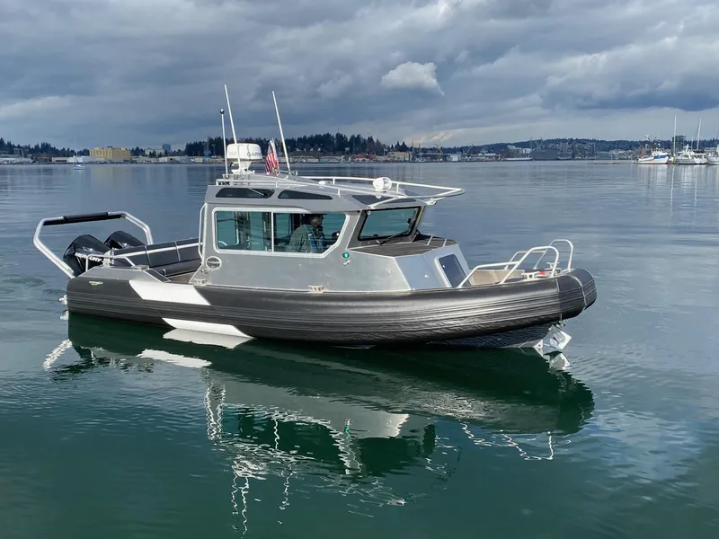 Slide: The Image of 2021 Life Proof 25 Full Cabin boat on calm water under cloudy skies. - 28