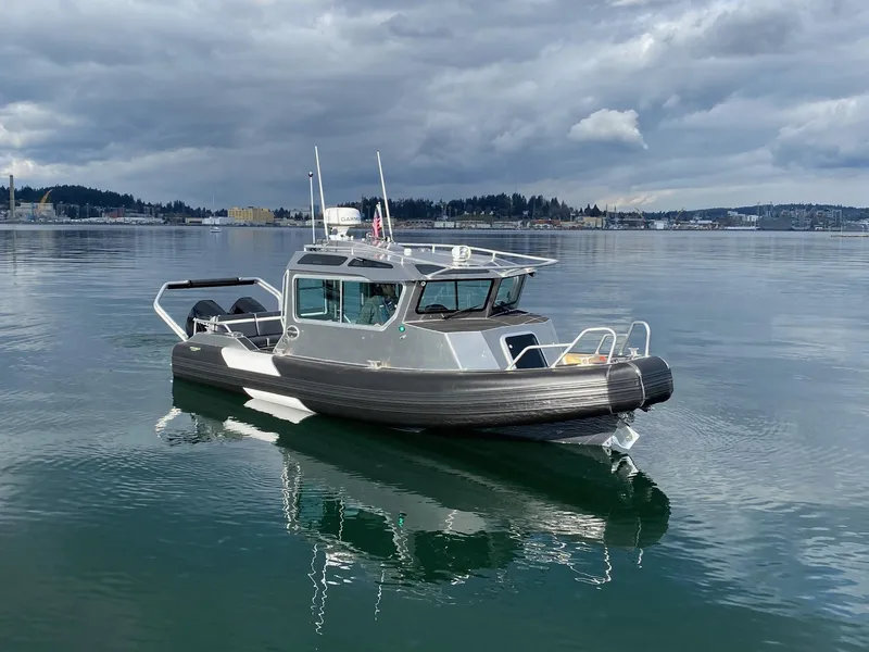 Slide: The Image of 2021 Life Proof 25 Full Cabin boat on calm water under cloudy sky. - 29