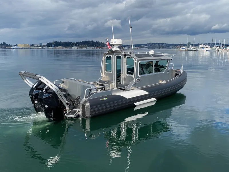 Slide: The Image of 2021 Life Proof 25 Full Cabin boat on calm water, overcast sky. - 3
