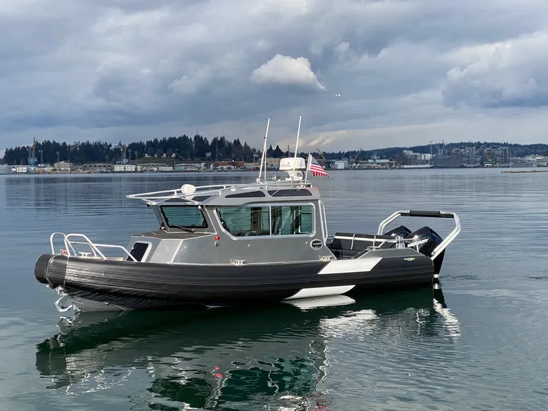 Slide: The Image of 2021 Life Proof 25 Full Cabin boat on calm water under cloudy sky. - 31