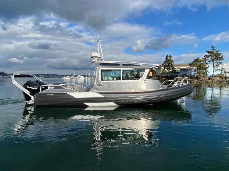 Slide: The Image of 2021 Life Proof 25 Full Cabin boat on calm water under cloudy sky. - 38