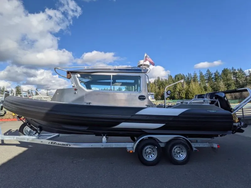 Slide: The Image of 2021 Life Proof 25 Full Cabin boat on trailer under blue sky. - 39
