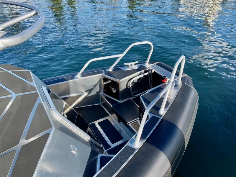 Slide: The Image of 2021 Life Proof 25 Full Cabin boat on water, featuring sleek design and sturdy construction. - 40