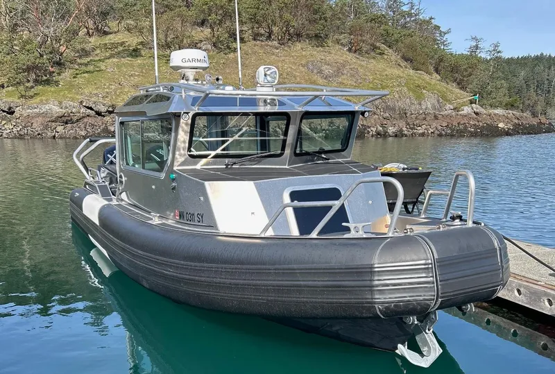 Slide: The Image of 2021 Life Proof 25 Full Cabin boat docked in a serene, wooded area. - 42