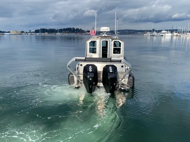 Slide: The Image of 2021 Life Proof 25 Full Cabin boat with dual engines on calm water. - 7