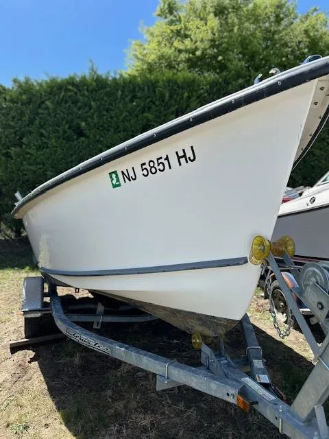 The Image of 2016 Allied Sportsman boat on trailer, registration NJ 5851 HJ, outdoors. - 0