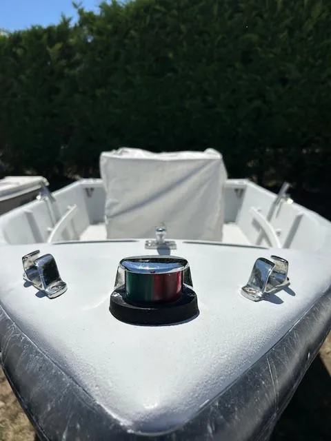 Slide: The Image of 2016 Allied Sportsman boat bow with navigation light and cleats. - 3