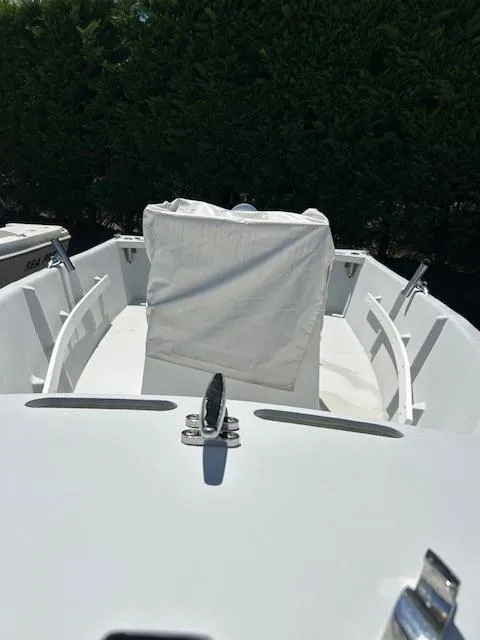 Slide: The Image of 2016 Allied Sportsman boat with white seating and sleek design. - 4