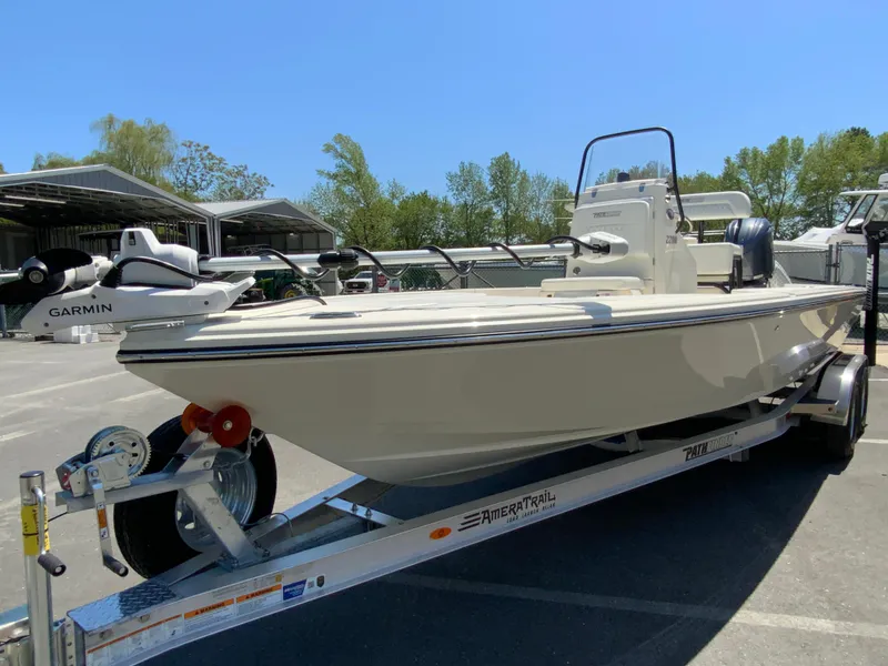 Slide: The Image of 2025 Pathfinder 2200 TRS boat on trailer, featuring Garmin equipment, parked outdoors. - 5