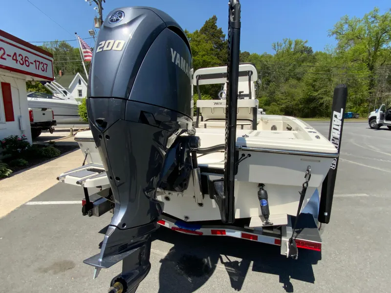 Slide: The Image of 2025 Pathfinder 2200 TRS boat with Yamaha 200 engine on a trailer. - 9