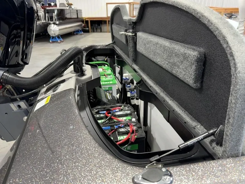 Slide: The Image of 2025 Skeeter ZXR19 boat battery compartment with wiring and components. - 16