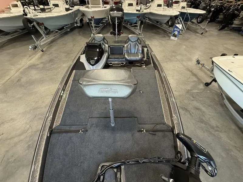 Slide: The Image of 2025 Skeeter ZXR19 fishing boat interior with seating and equipment in showroom. - 20