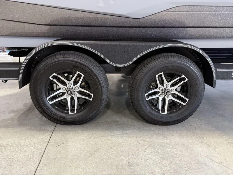 Slide: The Image of 2025 Skeeter ZXR19 trailer with dual wheels and sleek alloy rims. - 4