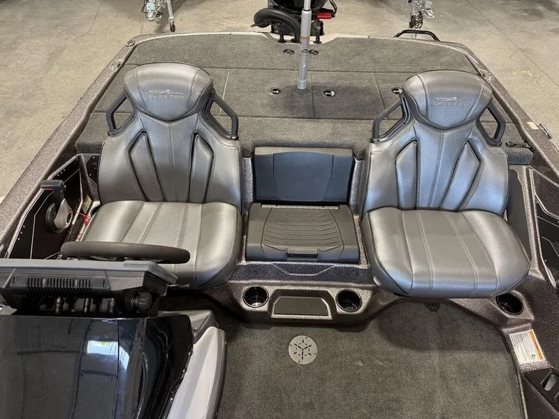Slide: The Image of 2025 Skeeter ZXR19 boat interior with dual gray seats and modern dashboard. - 6