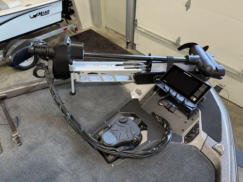 Slide: The Image of 2025 Skeeter ZXR19 boat with advanced trolling motor and navigation system in a garage setting. - 9
