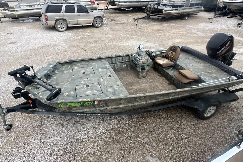 Slide: The Image of 2016 Ranger 1862 MPV fishing boat with camouflage design on a trailer. - 4