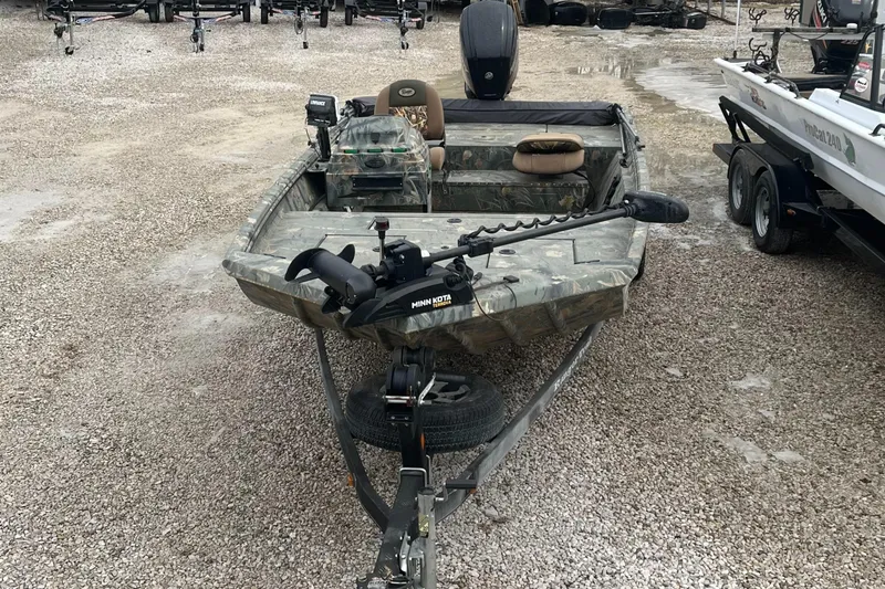 Slide: The Image of 2016 Ranger 1862 MPV boat with camouflage design on gravel lot. - 6