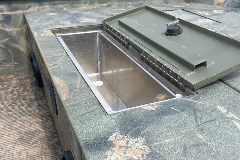 Slide: The Image of 2016 Ranger 1862 MPV boat with open storage compartment, camo design. - 9