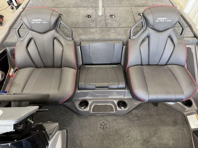 Slide: The Image of 2025 Skeeter ZXR19 boat interior with dual black seats and center console. - 12