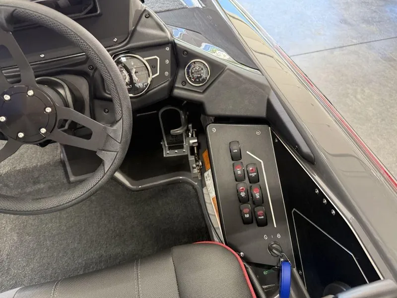 Slide: The Image of Interior of 2025 Skeeter ZXR19 boat showing steering wheel and control panel. - 15