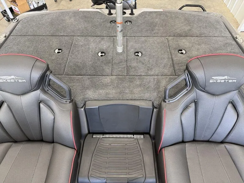Slide: The Image of Interior of 2025 Skeeter ZXR19 boat with gray seats and carpeted deck. - 17