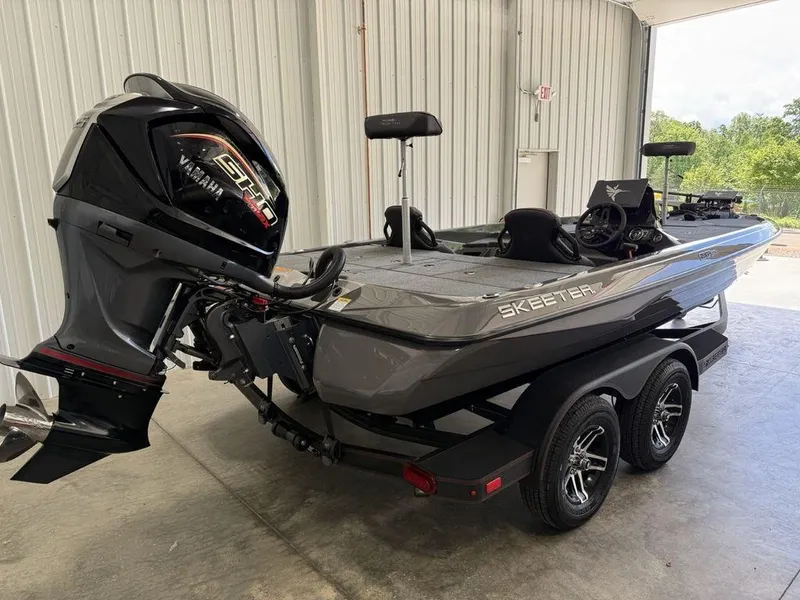 Slide: The Image of 2025 Skeeter ZXR19 boat with Yamaha engine in a garage setting. - 3