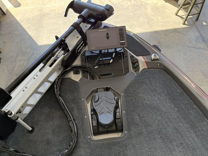 Slide: The Image of 2025 Skeeter ZXR19 boat deck with control panel and navigation system. - 4