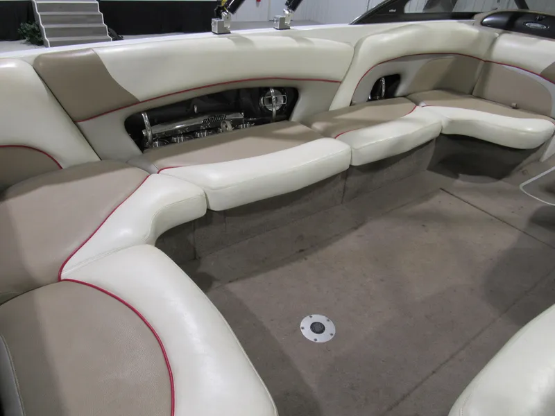 Slide: The Image of 2007 Malibu Sunscape 247 LSV boat interior with beige and white seating. - 6