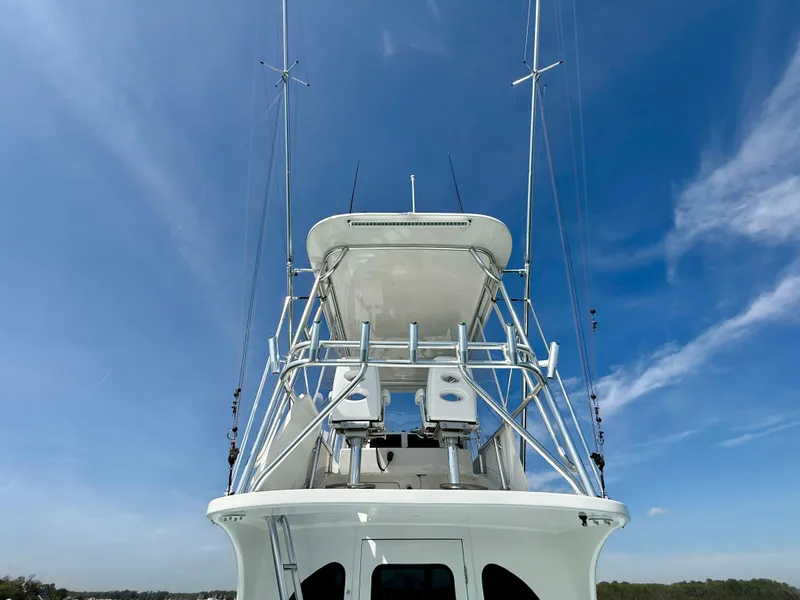 Slide: The Image of 2023 Millennium Marine NuWave 37 boat with tower against clear blue sky. - 14