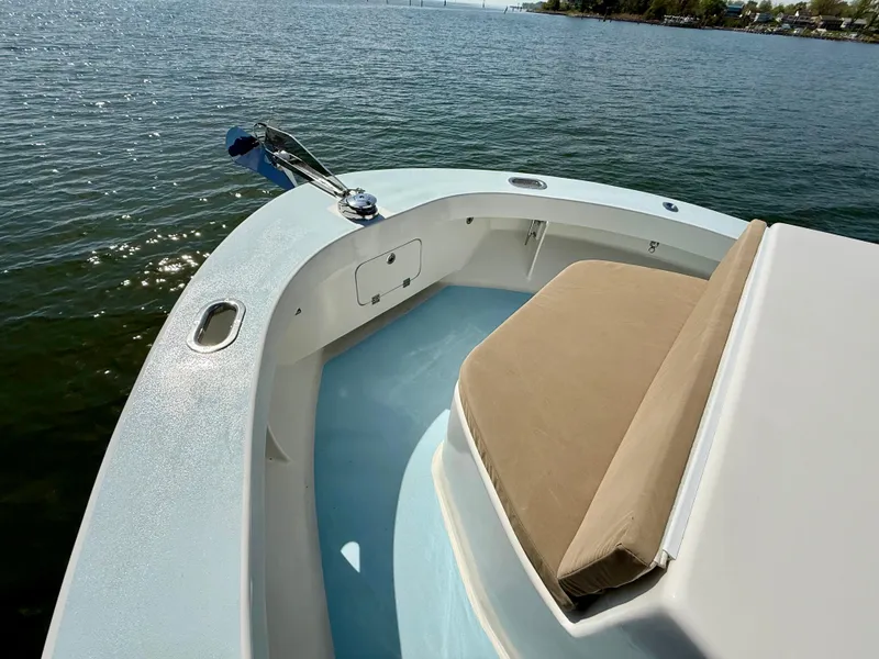 Slide: The Image of 2023 Millennium Marine NuWave 37 boat, featuring a spacious deck and comfortable seating on calm waters. - 19