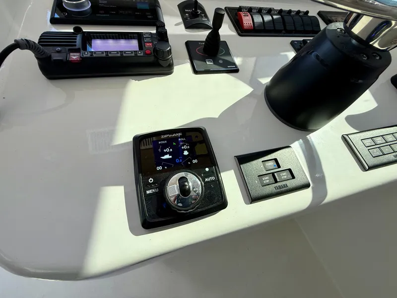 Slide: The Image of Control panel of 2023 Millennium Marine NuWave 37 boat with navigation and communication devices. - 40