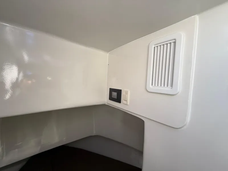 Slide: The Image of Interior cabin of 2023 Millennium Marine NuWave 37 with vent and control panel. - 48