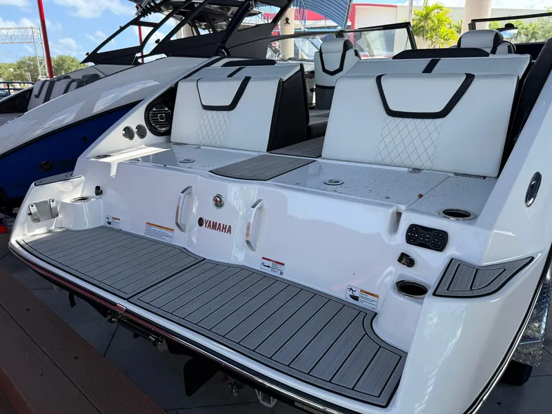 Slide: The Image of 2025 Yamaha Boats 222SD, sleek white design, luxury seating, modern features. - 3