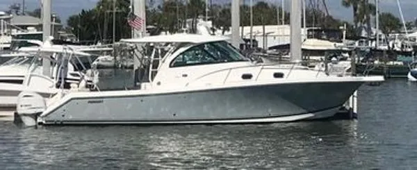 The Image of 2019 Pursuit OS 385 Offshore boat docked in a marina. - 0